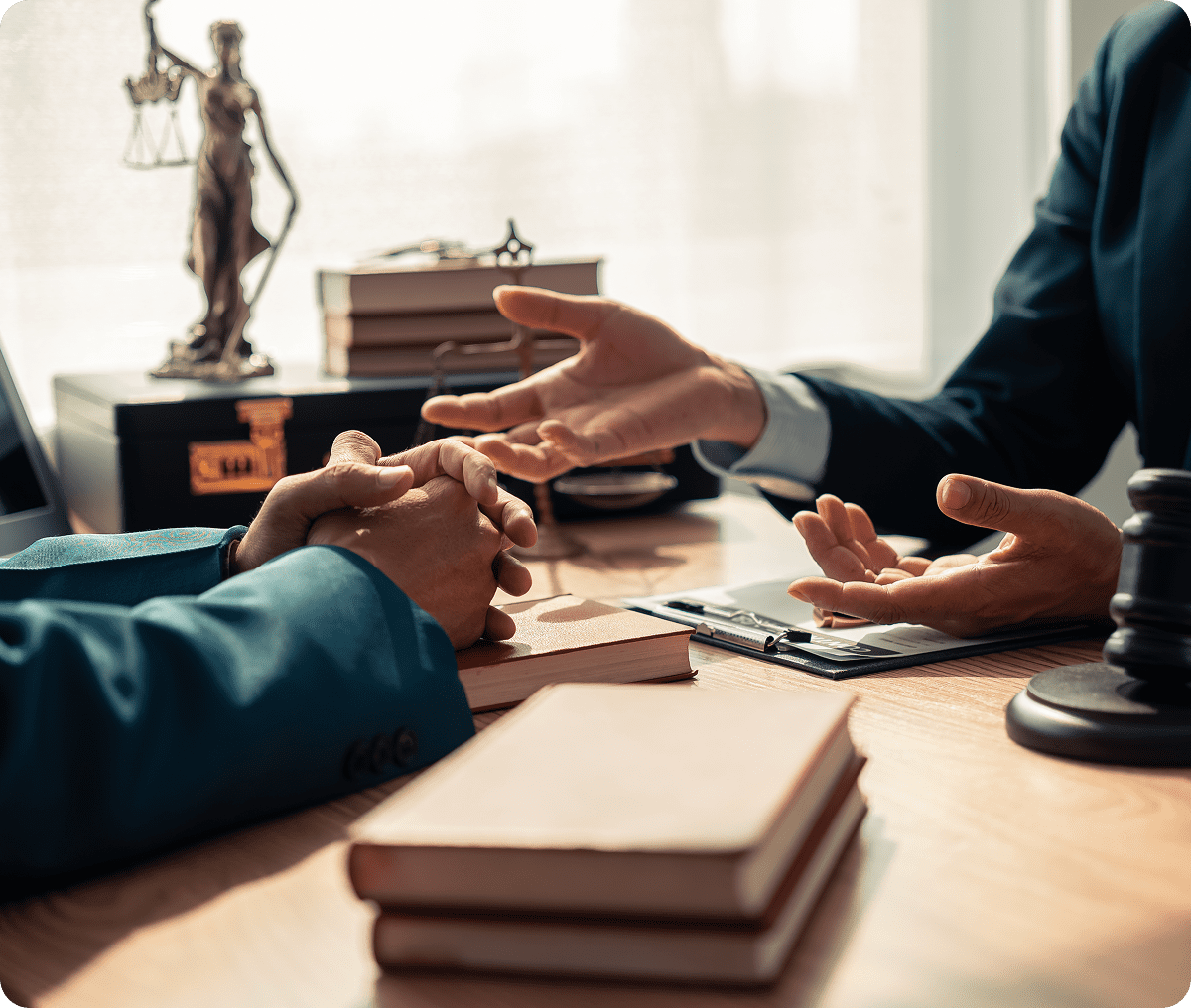 Hands gesturing during legal consultation
